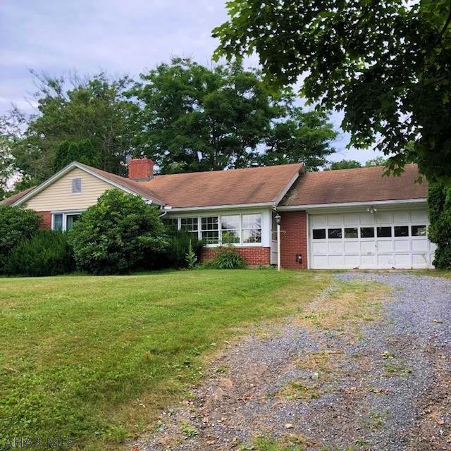 525 Egolf Road Bedford, PA 15522 - Photo 2 of 61 a front view of a house with a garden