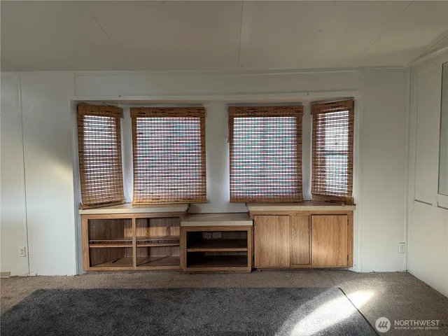 a view of a livingroom with furniture and window