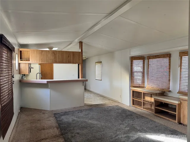 a kitchen with a stove and white cabinets
