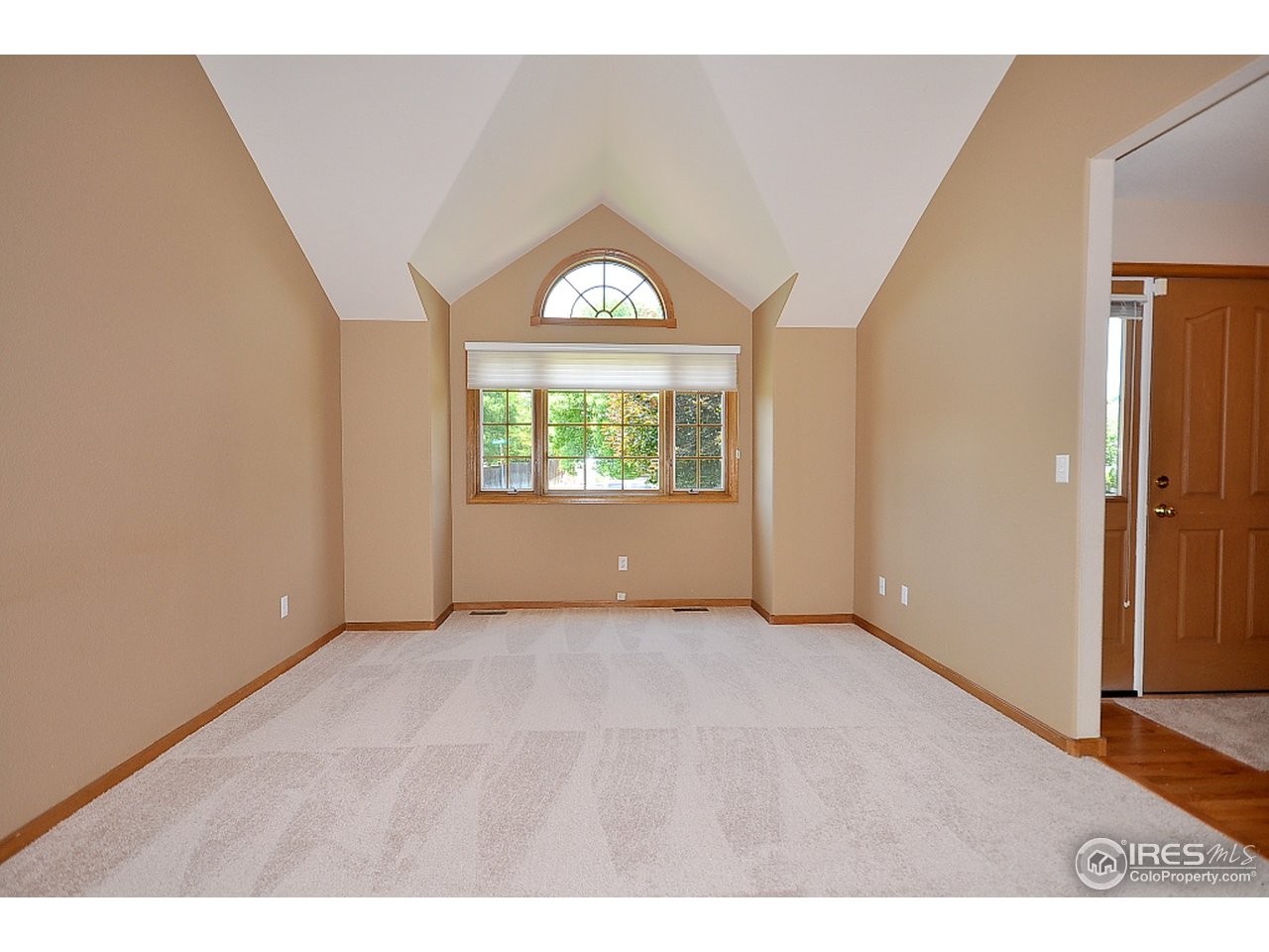 Living room with vaulted ceilings