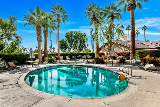 a view of a swimming pool with a patio