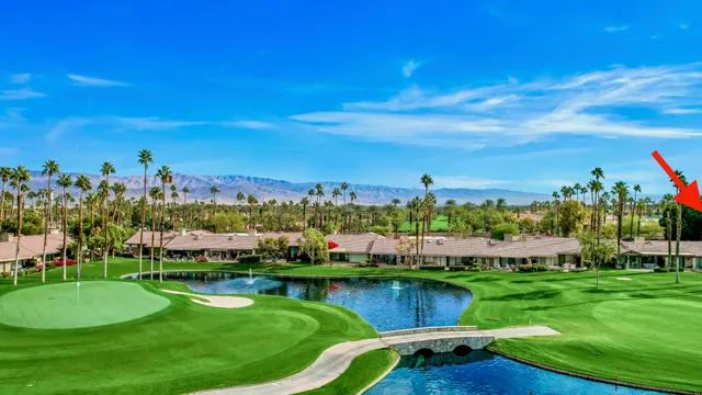 a view of a lake with a building in the background