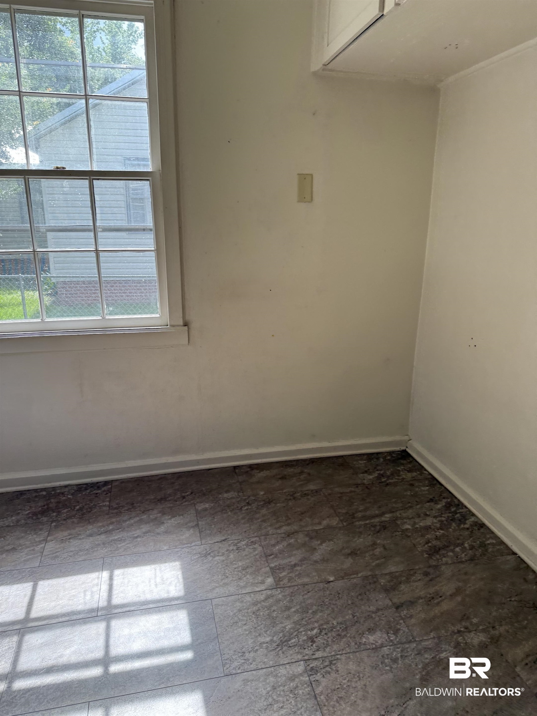 502 East Myrtle Avenue Foley, AL 36535 - Photo 5 of 9 Spare room with healthy amount of natural light