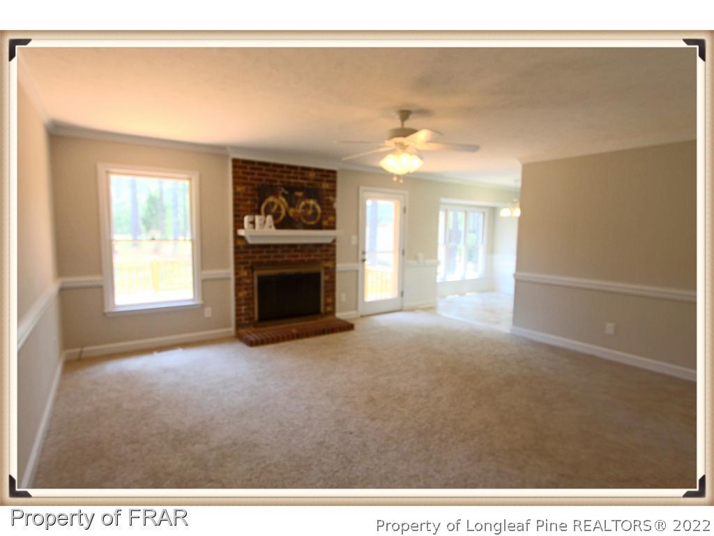 7786 Dragonhead Road Fayetteville, NC 28311 - Photo 16 of 33 a view interior of a house a fireplace & a window