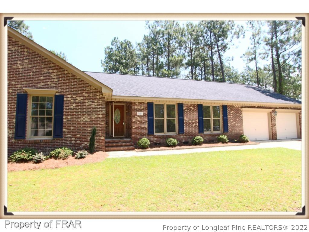7786 Dragonhead Road Fayetteville, NC 28311 - Photo 2 of 33 a front view of a house with a yard