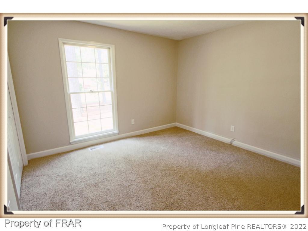 7786 Dragonhead Road Fayetteville, NC 28311 - Photo 23 of 33 an empty room with windows