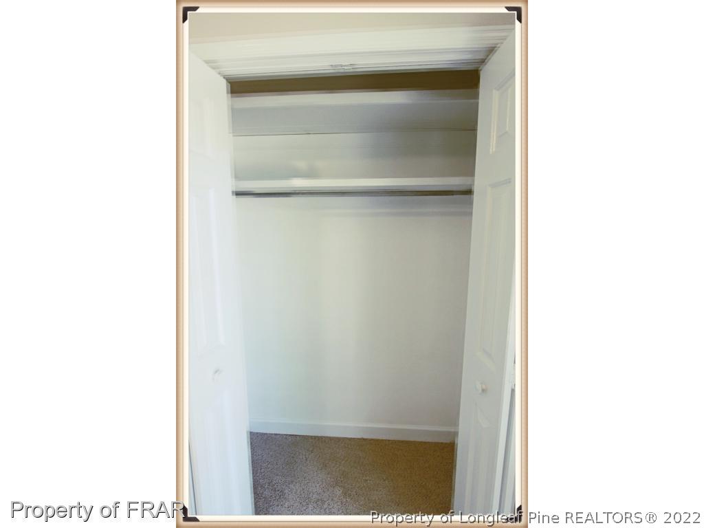 7786 Dragonhead Road Fayetteville, NC 28311 - Photo 24 of 33 a view of a hallway with white walls