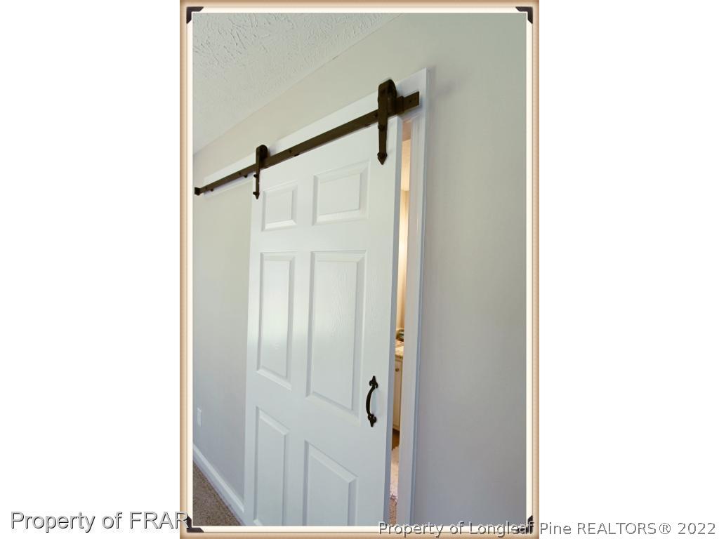 7786 Dragonhead Road Fayetteville, NC 28311 - Photo 26 of 33 a picture of a bathroom with a shower curtain