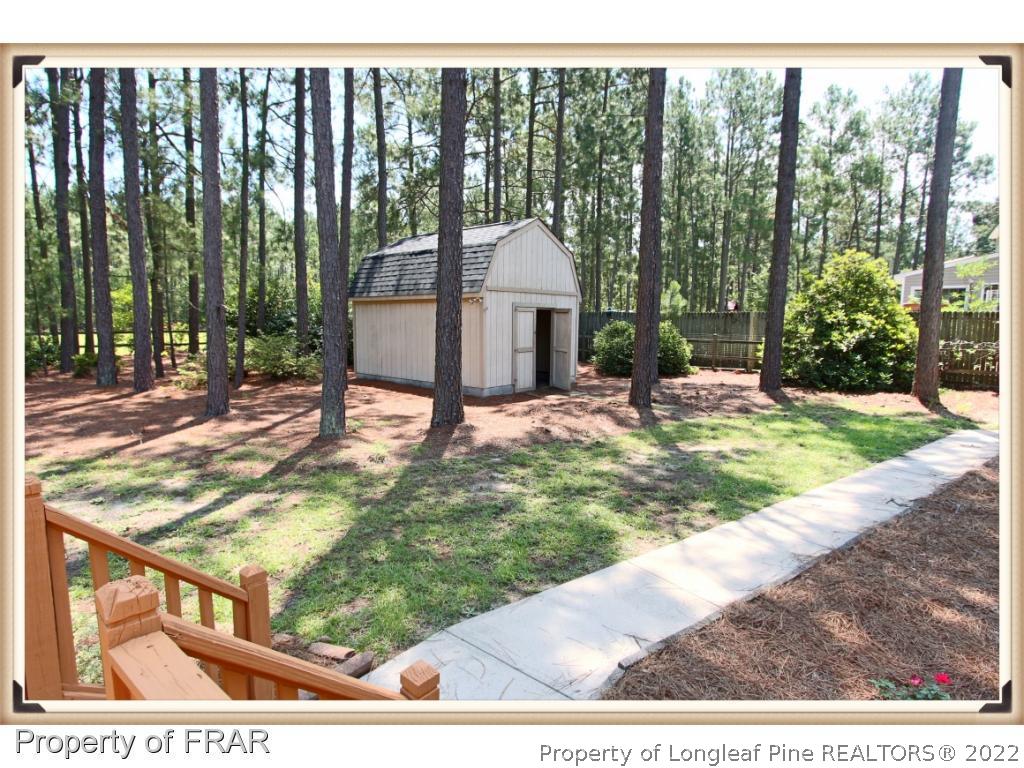 7786 Dragonhead Road Fayetteville, NC 28311 - Photo 30 of 33 a view of a porch with a backyard