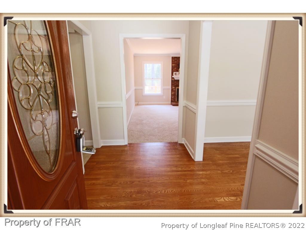 7786 Dragonhead Road Fayetteville, NC 28311 - Photo 3 of 33 a view of entryway with wooden floor