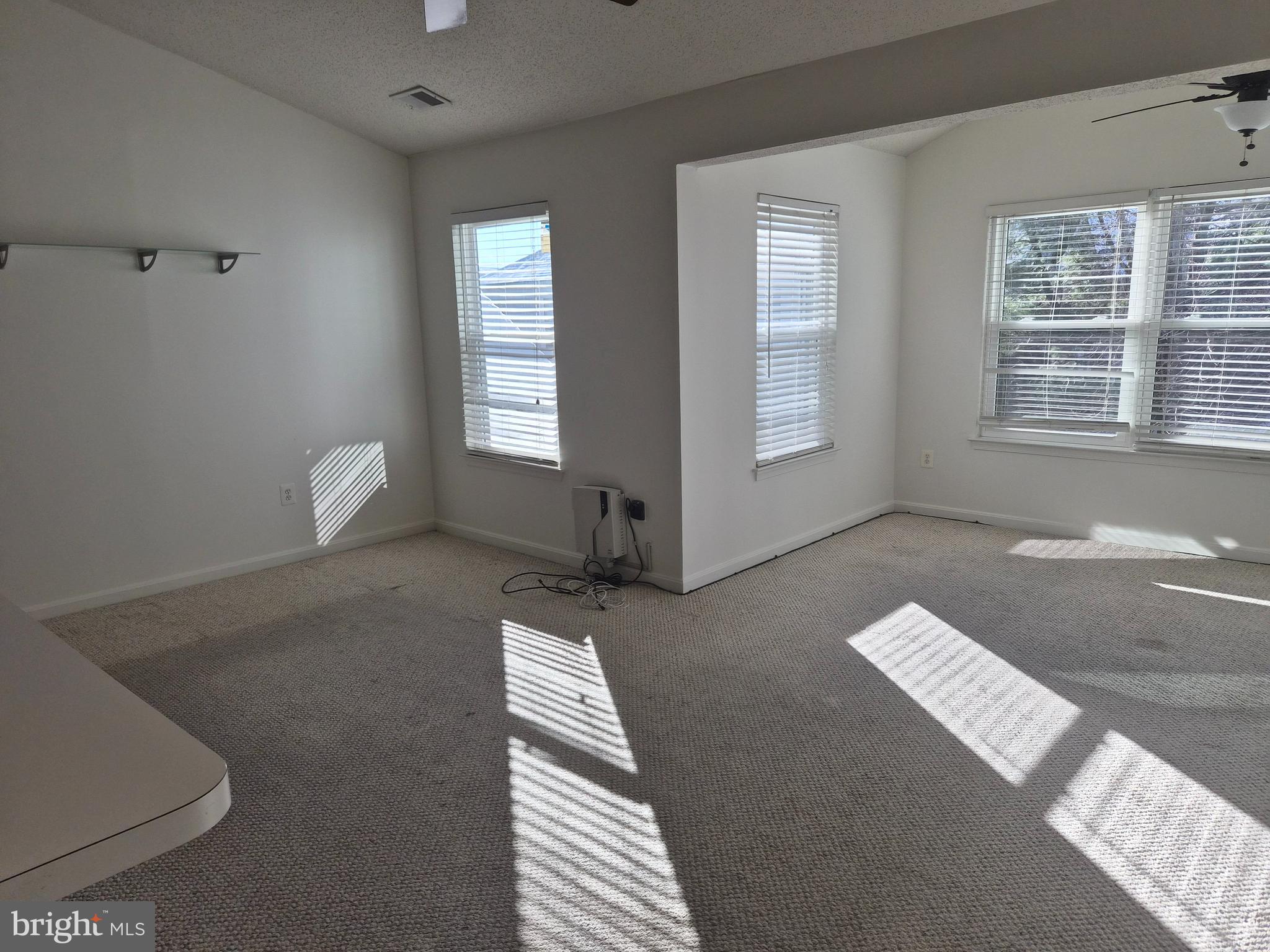 2706 Snowbird Terrace, Unit 1220 Silver Spring, MD 20906 - Photo 13 of 24 a view of an empty room with windows