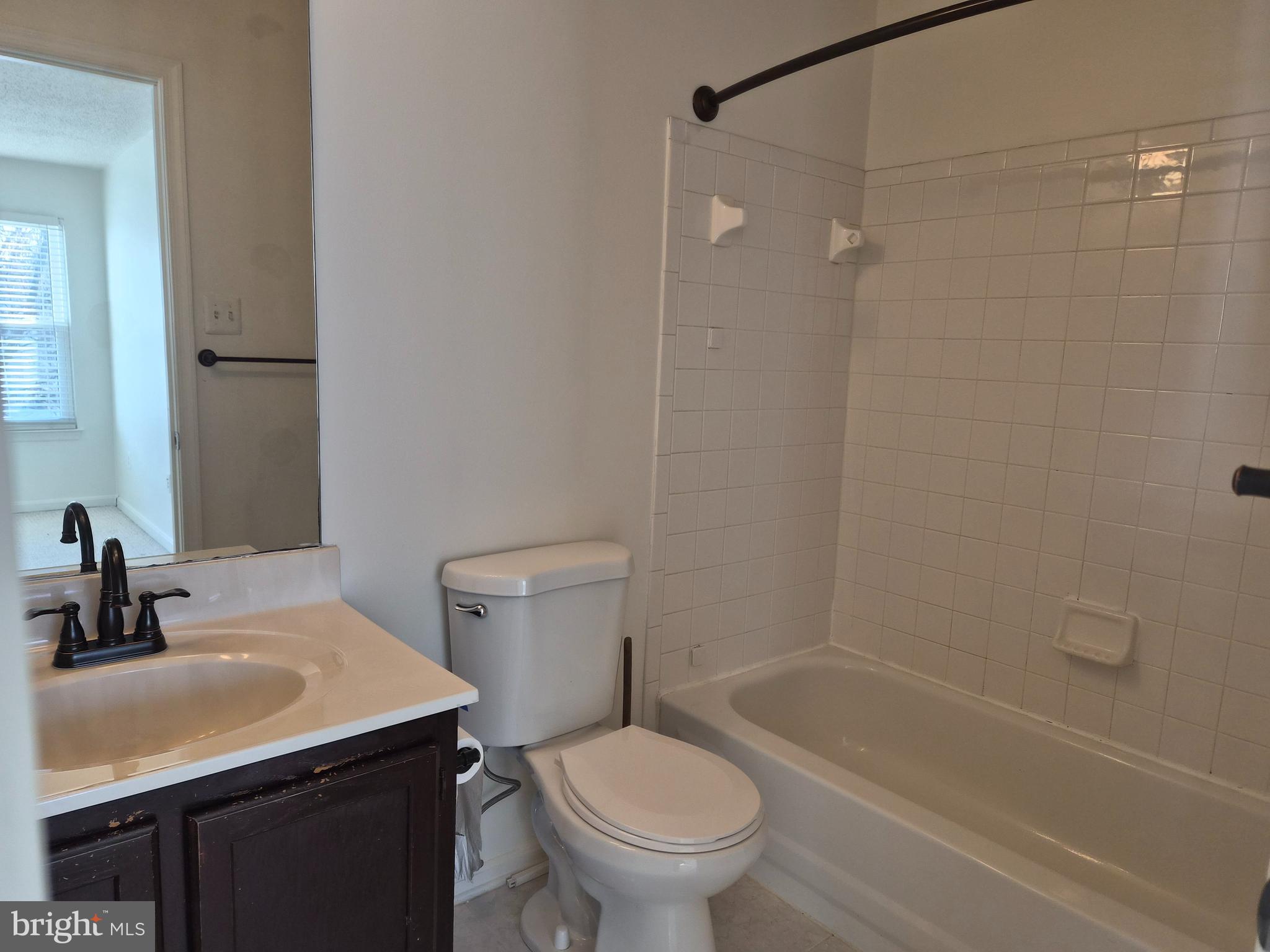 2706 Snowbird Terrace, Unit 1220 Silver Spring, MD 20906 - Photo 19 of 24 a bathroom with a sink toilet and shower
