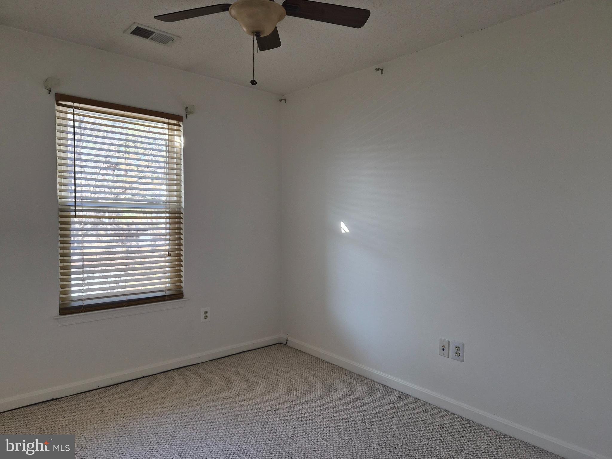 2706 Snowbird Terrace, Unit 1220 Silver Spring, MD 20906 - Photo 20 of 24 a view of an empty room with a window