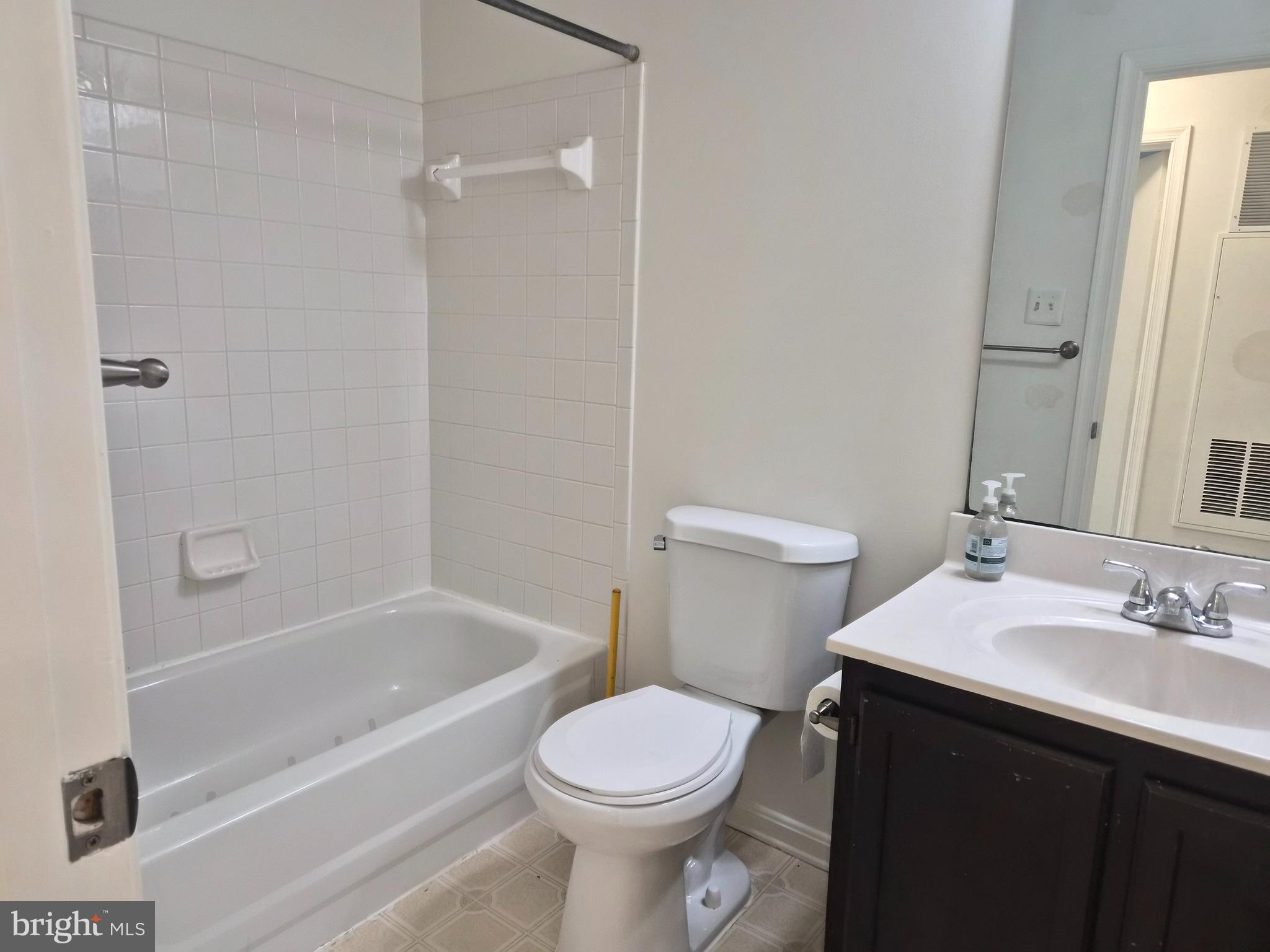 2706 Snowbird Terrace, Unit 1220 Silver Spring, MD 20906 - Photo 22 of 24 a bathroom with a sink toilet and shower