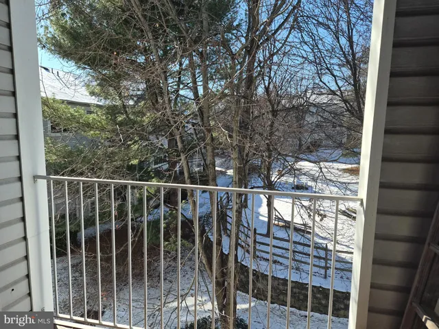 a view of a balcony with a tree