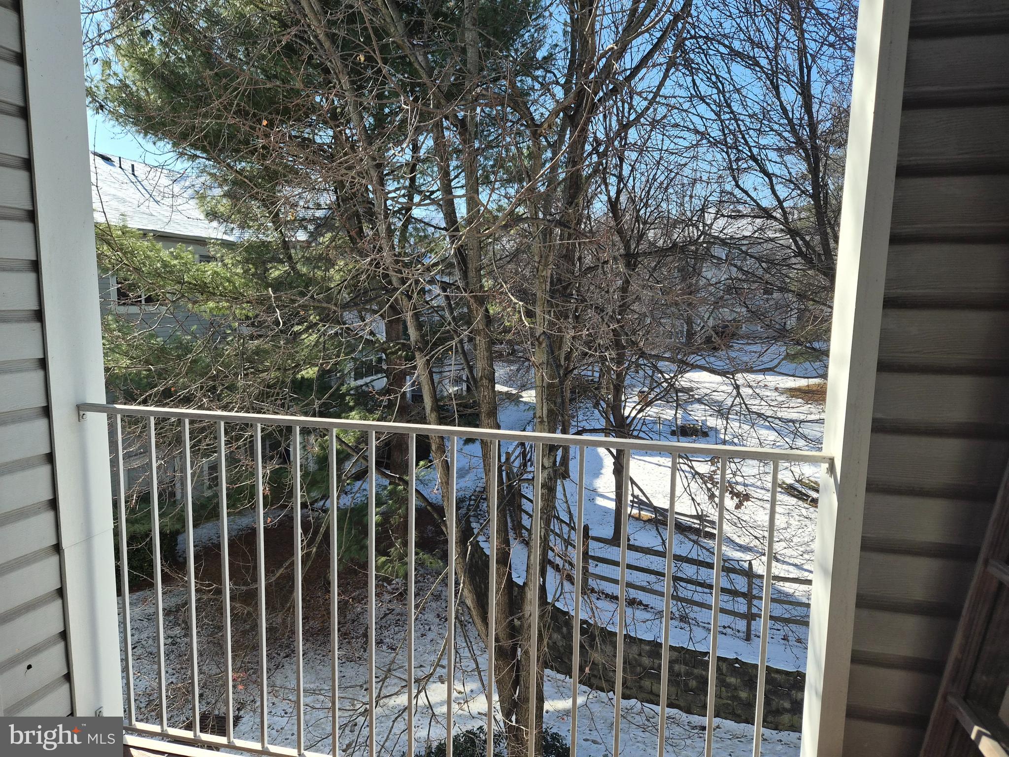 2706 Snowbird Terrace, Unit 1220 Silver Spring, MD 20906 - Photo 23 of 24 a view of a balcony with a tree