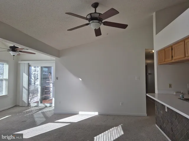 a view of a kitchen with a sink and cabinet area