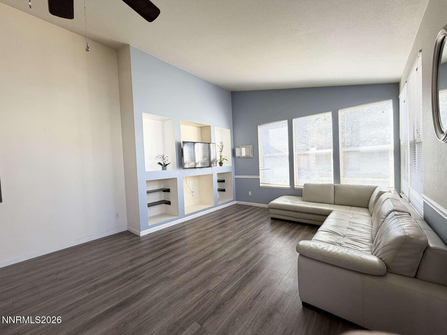 4695 Hampton Lane Reno, NV 89519 - Photo 2 of 20 a living room with furniture and a wooden floor