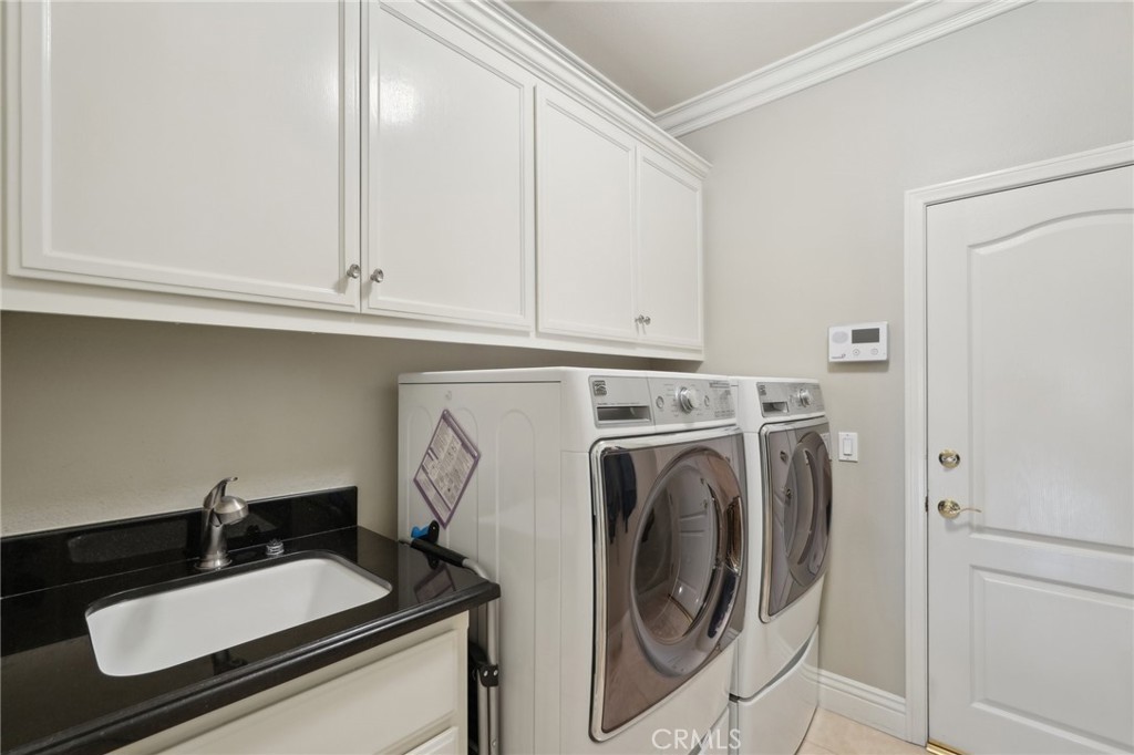5965 Vía Loma Riverside, CA 92506 - Photo 27 of 41 a close view of a sink and washer and dryer