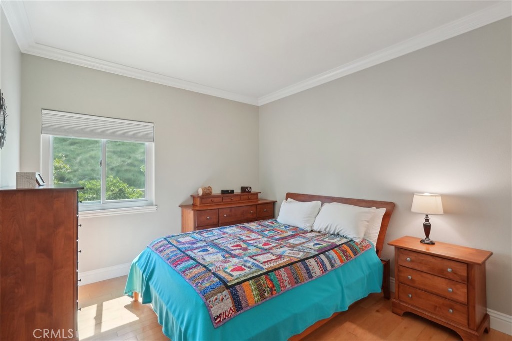 5965 Vía Loma Riverside, CA 92506 - Photo 28 of 41 a bedroom with a bed and window