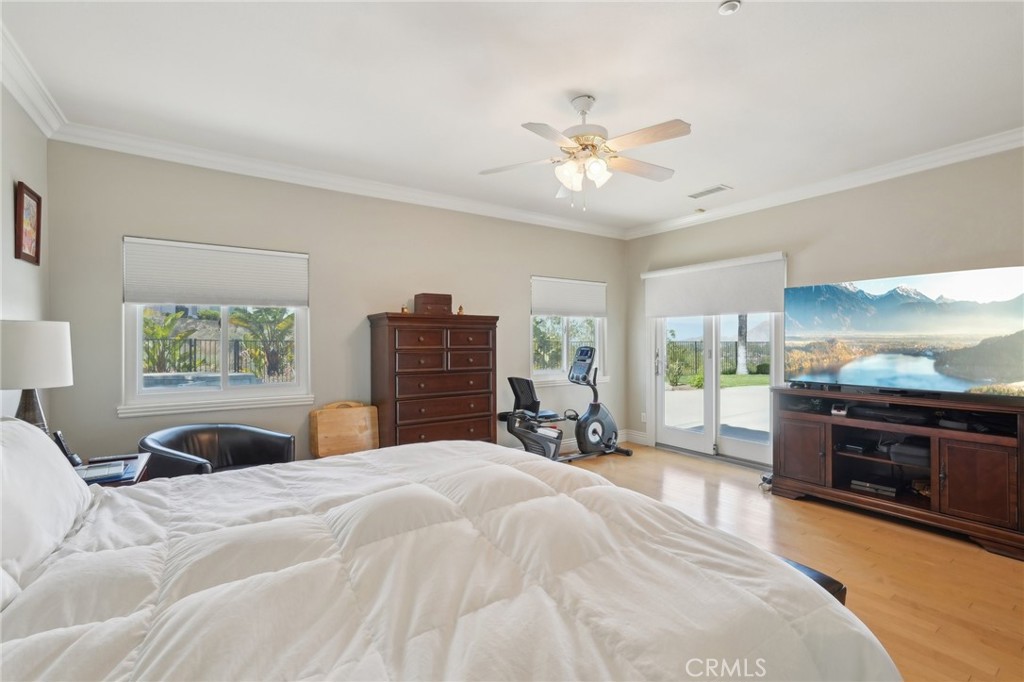 5965 Vía Loma Riverside, CA 92506 - Photo 33 of 41 a bedroom with a bed and dresser with mirror