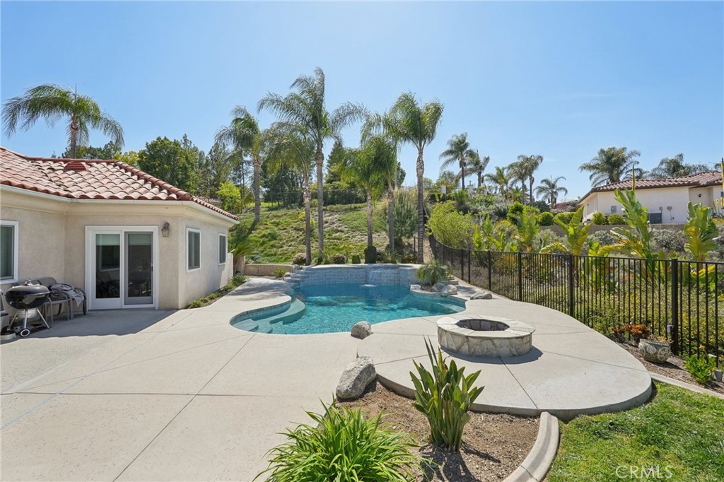 5965 Vía Loma Riverside, CA 92506 - Photo 35 of 41 a view of a patio with table and chairs potted plants with wooden floor