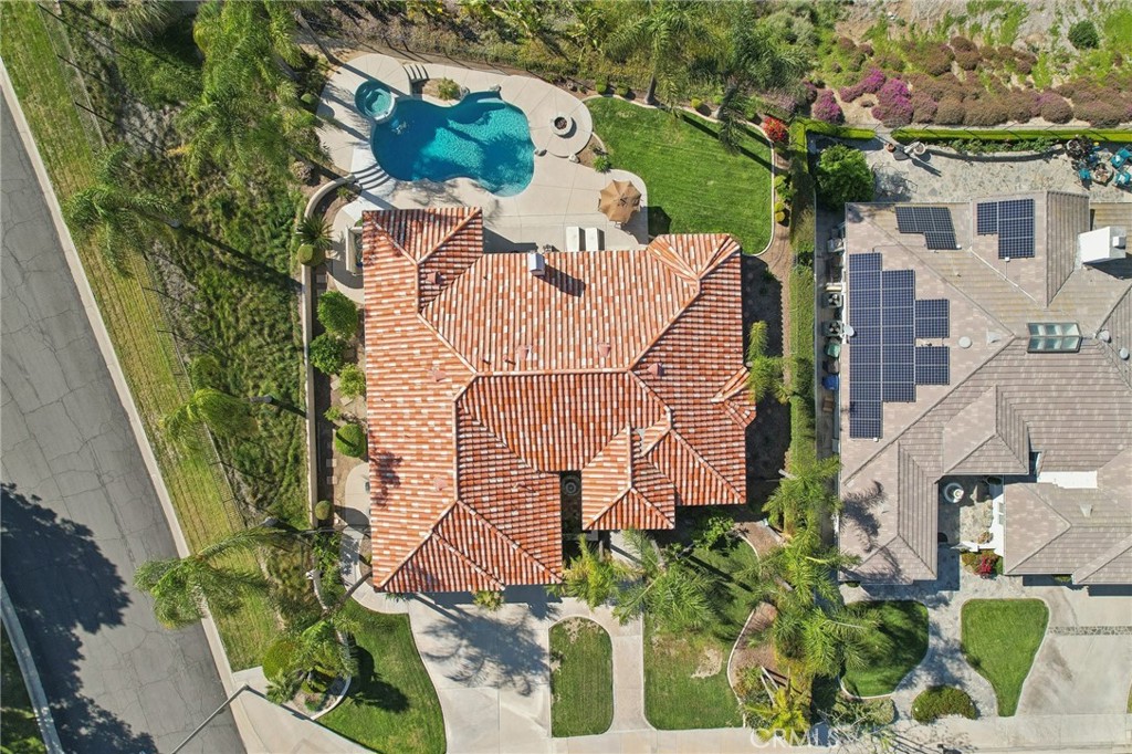 5965 Vía Loma Riverside, CA 92506 - Photo 38 of 41 an aerial view of a house with a yard and garden
