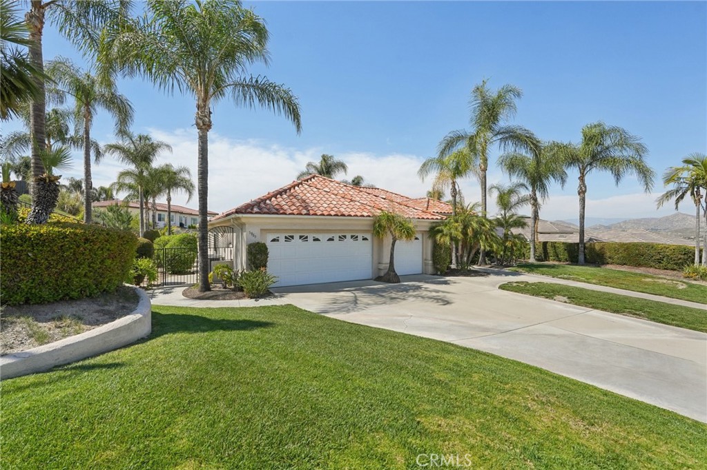 5965 Vía Loma Riverside, CA 92506 - Photo 6 of 41 a view of a house with a yard and palm trees