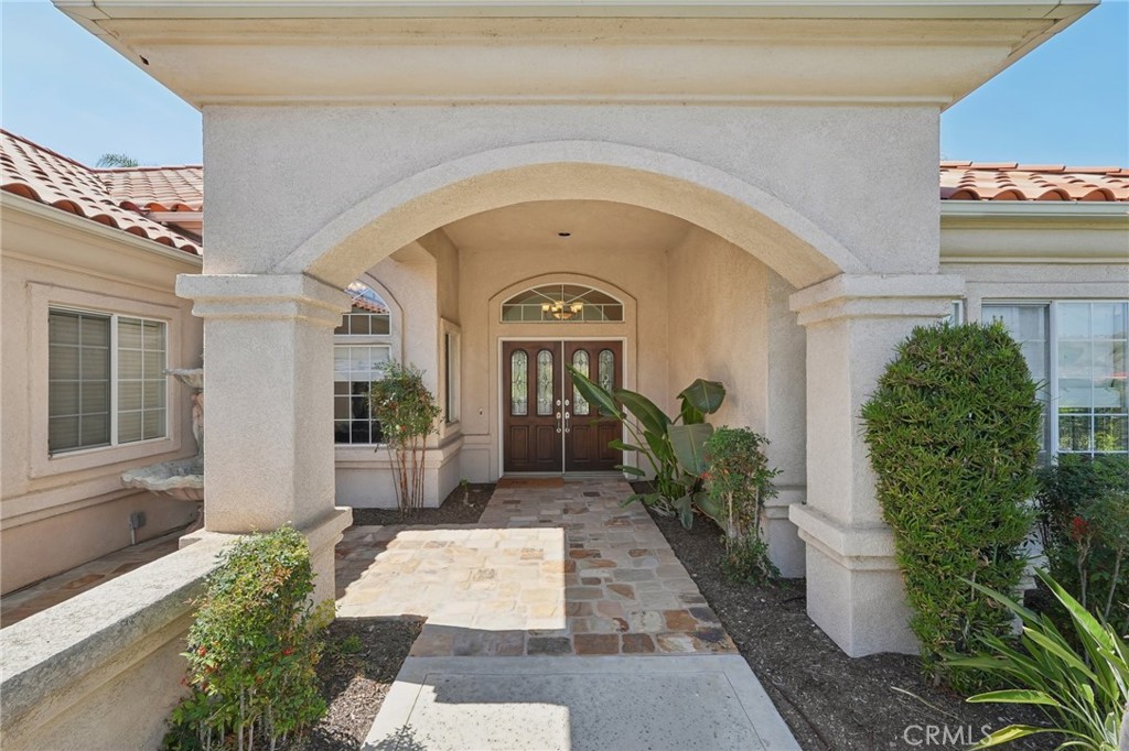 5965 Vía Loma Riverside, CA 92506 - Photo 9 of 41 a front view of a house with a lots of potted plants