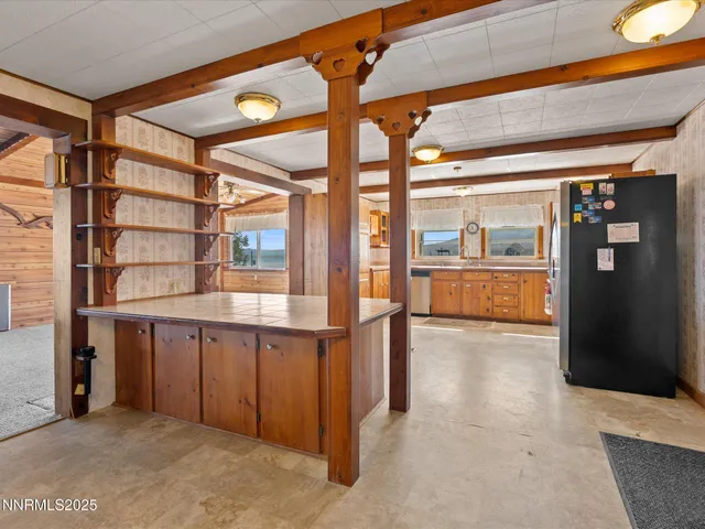 a kitchen with stainless steel appliances granite countertop a refrigerator a oven a sink and dishwasher