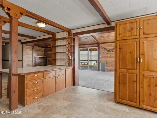 a view of an empty room with a fireplace