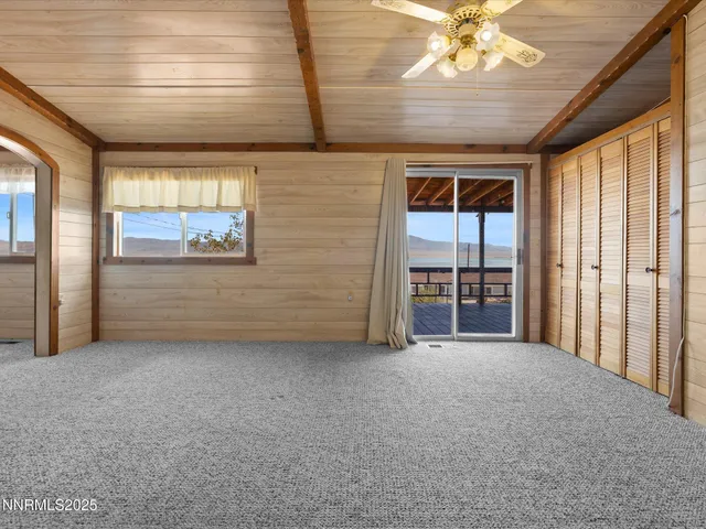 a bathroom with a granite countertop shower and a sink