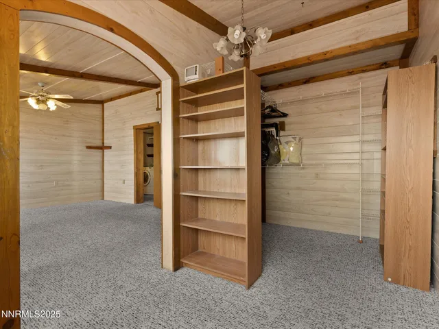 a very nice looking room with a large mirror and furniture