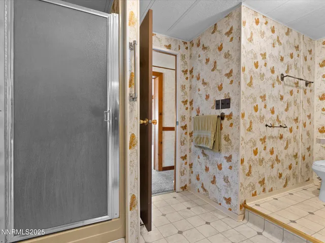 a view of a house with a snow in the background