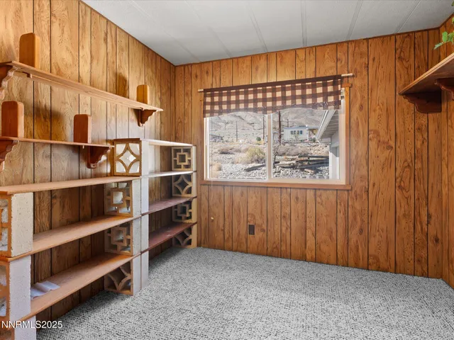 a view of living room with balcony and furniture
