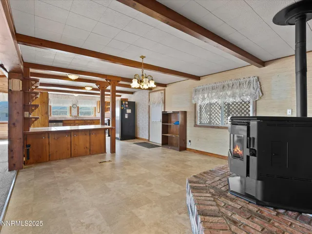 a large kitchen with stainless steel appliances granite countertop a stove sink and refrigerator