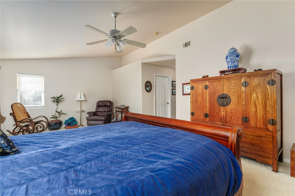 535 Charro Way Nipomo, CA 93444 - Photo 12 of 34 a bed room with a bed and gym equipment