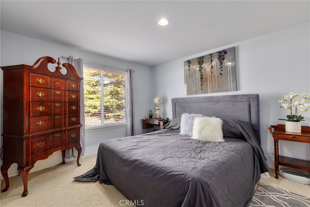 535 Charro Way Nipomo, CA 93444 - Photo 15 of 34 a bedroom with a bed and a window