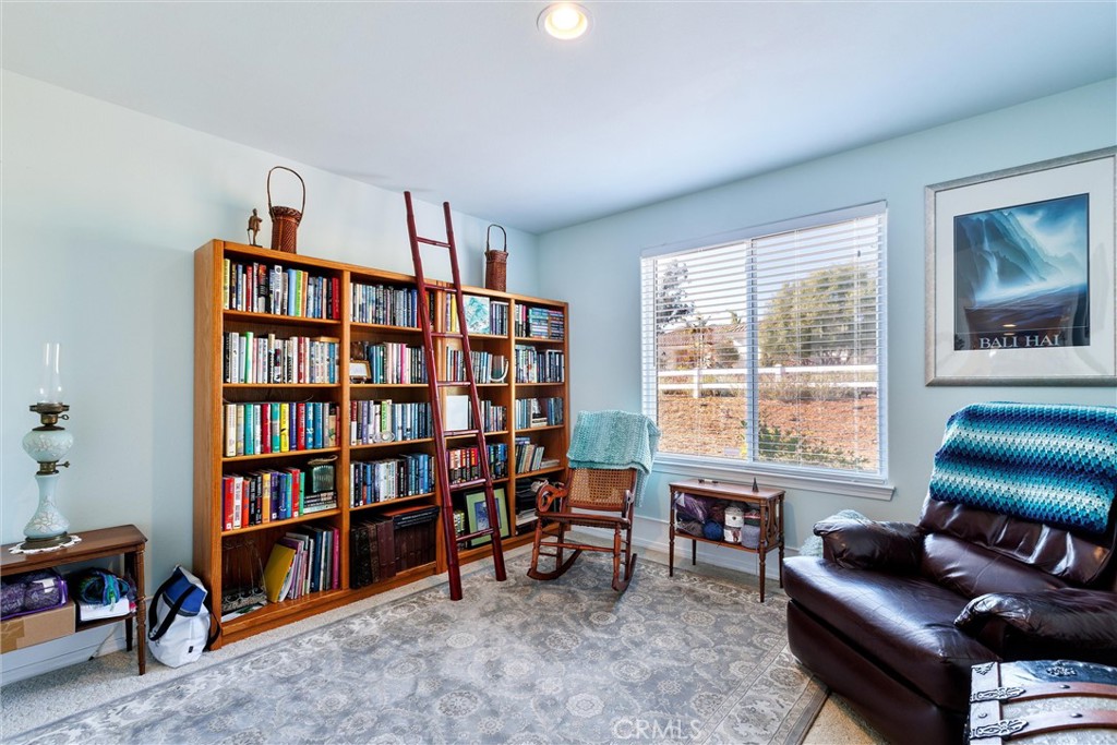 535 Charro Way Nipomo, CA 93444 - Photo 17 of 34 a living room with furniture and a book shelf