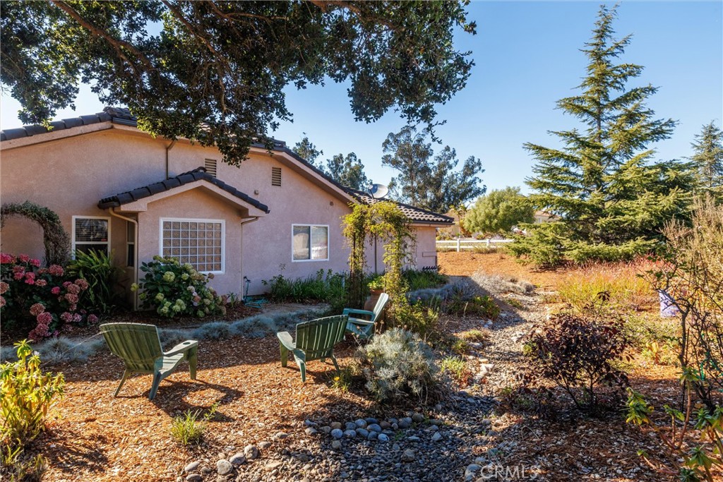 535 Charro Way Nipomo, CA 93444 - Photo 21 of 34 a view of house with a yard and potted plants