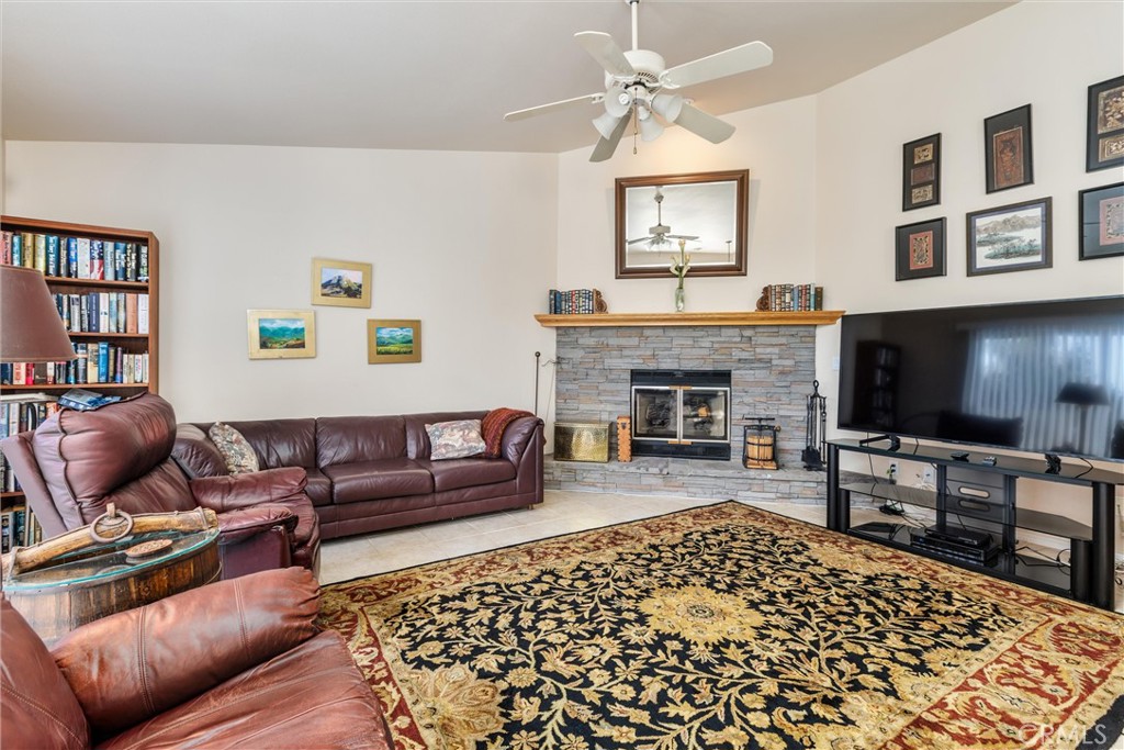 535 Charro Way Nipomo, CA 93444 - Photo 10 of 34 a living room with furniture fireplace and flat screen tv