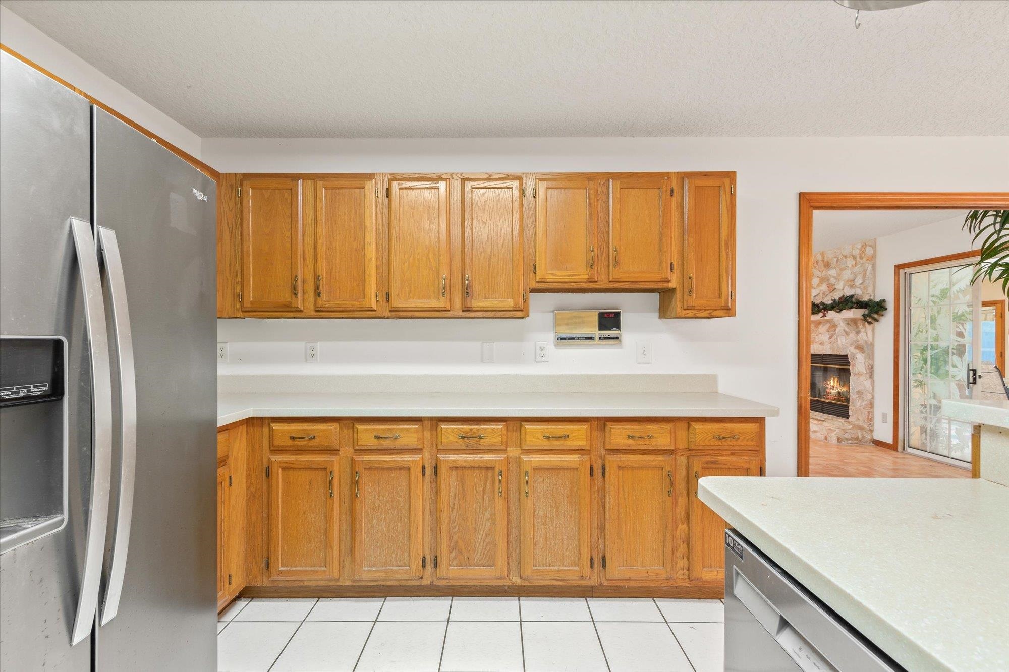 913 Chippewa Street St. Augustine, FL 32086 - Photo 15 of 56 a kitchen with stainless steel appliances a refrigerator sink and cabinets