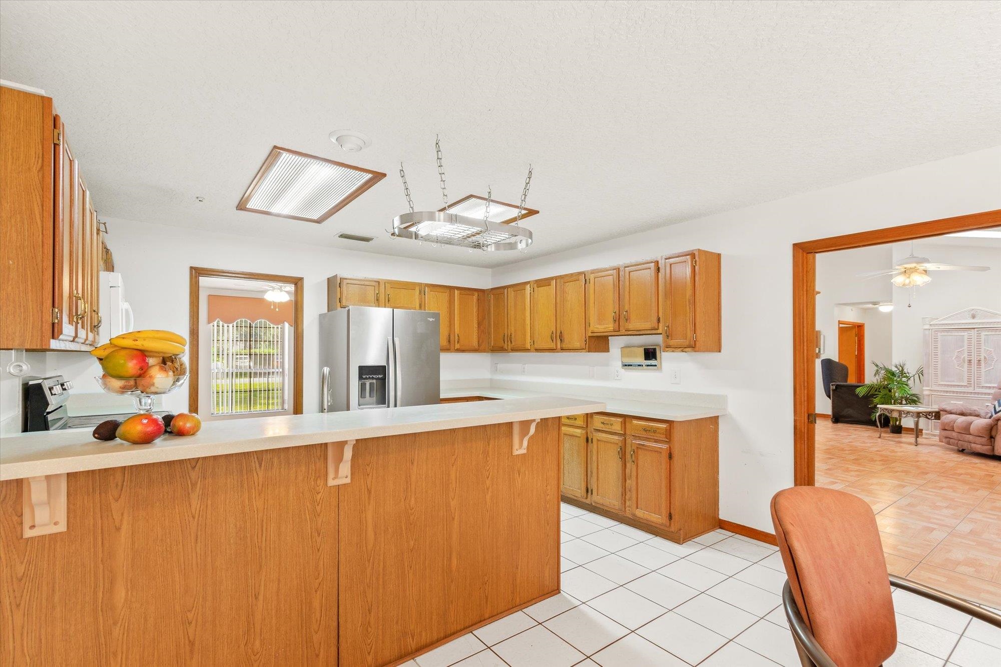913 Chippewa Street St. Augustine, FL 32086 - Photo 16 of 56 a large white kitchen with a large window