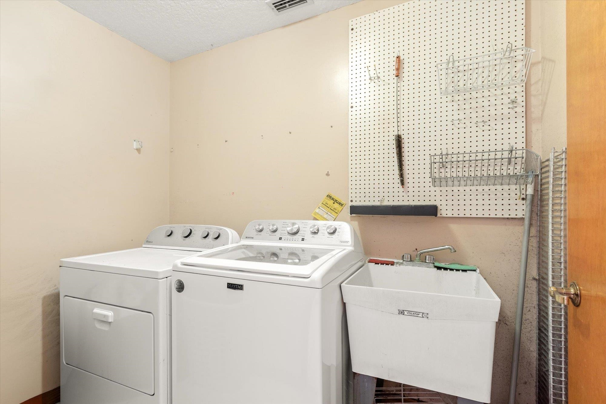 913 Chippewa Street St. Augustine, FL 32086 - Photo 18 of 56 a utility room with dryer and washer