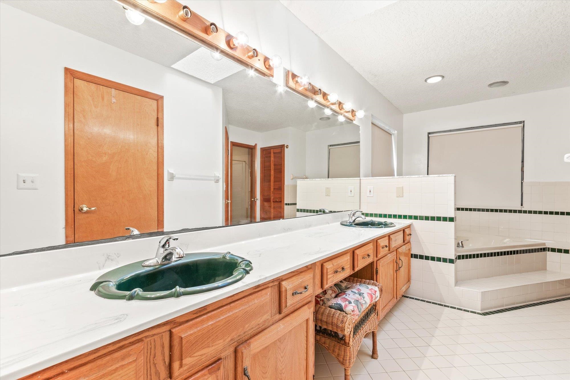 913 Chippewa Street St. Augustine, FL 32086 - Photo 22 of 56 a kitchen with stainless steel appliances granite countertop a sink and a stove top oven with wooden floor