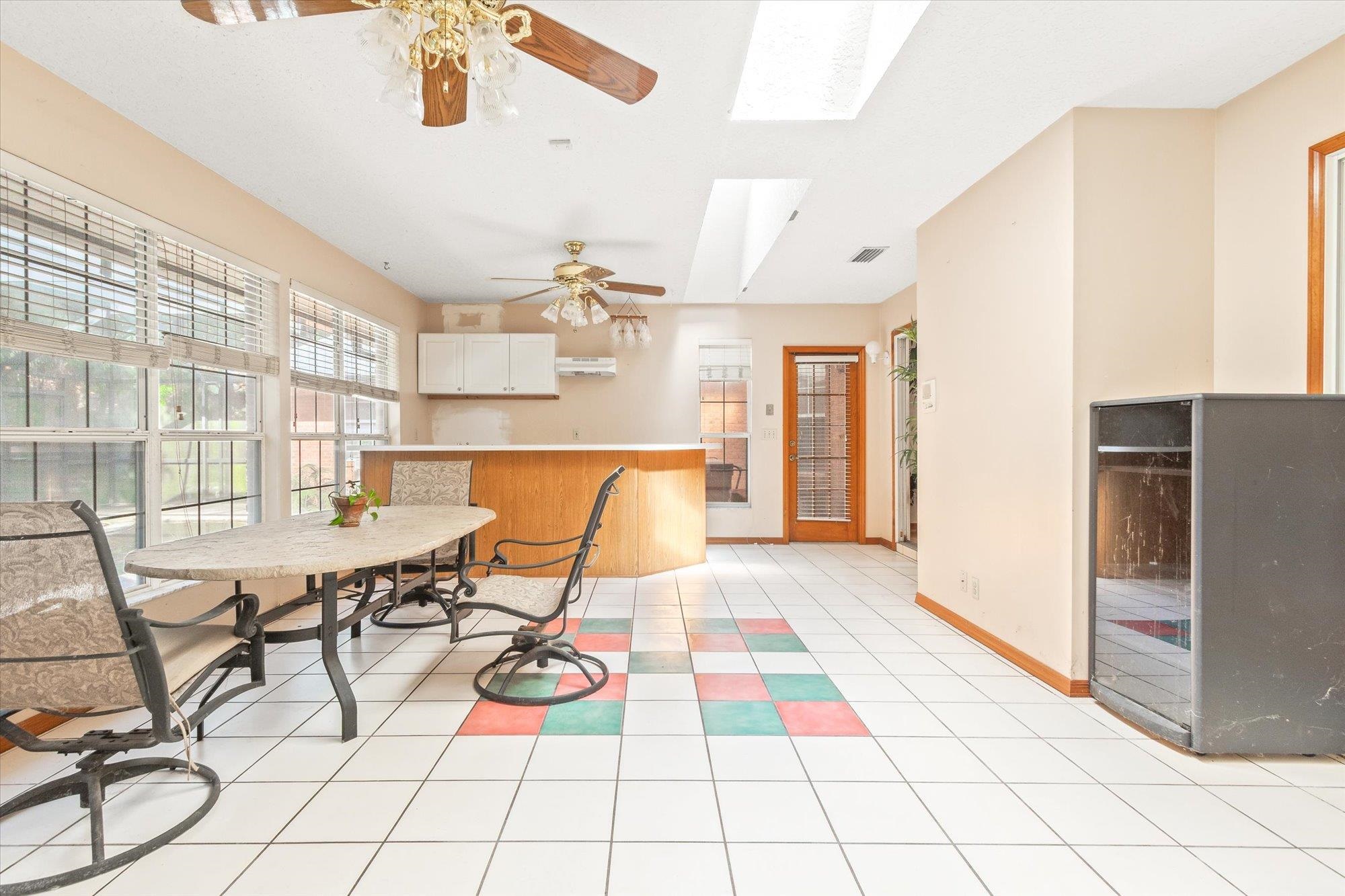913 Chippewa Street St. Augustine, FL 32086 - Photo 26 of 56 a view of a dining room with furniture and chandelier