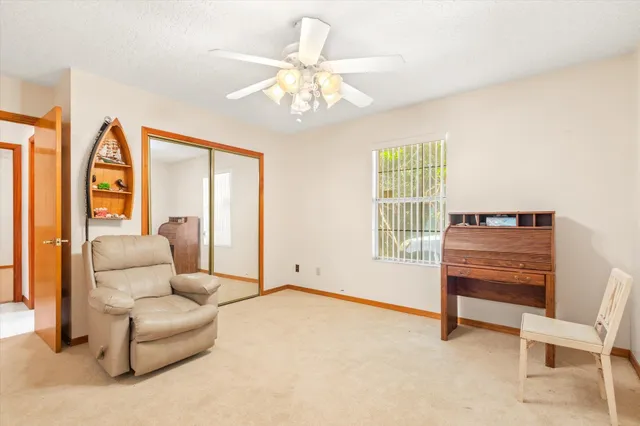 a view of a swimming pool with a patio and a yard