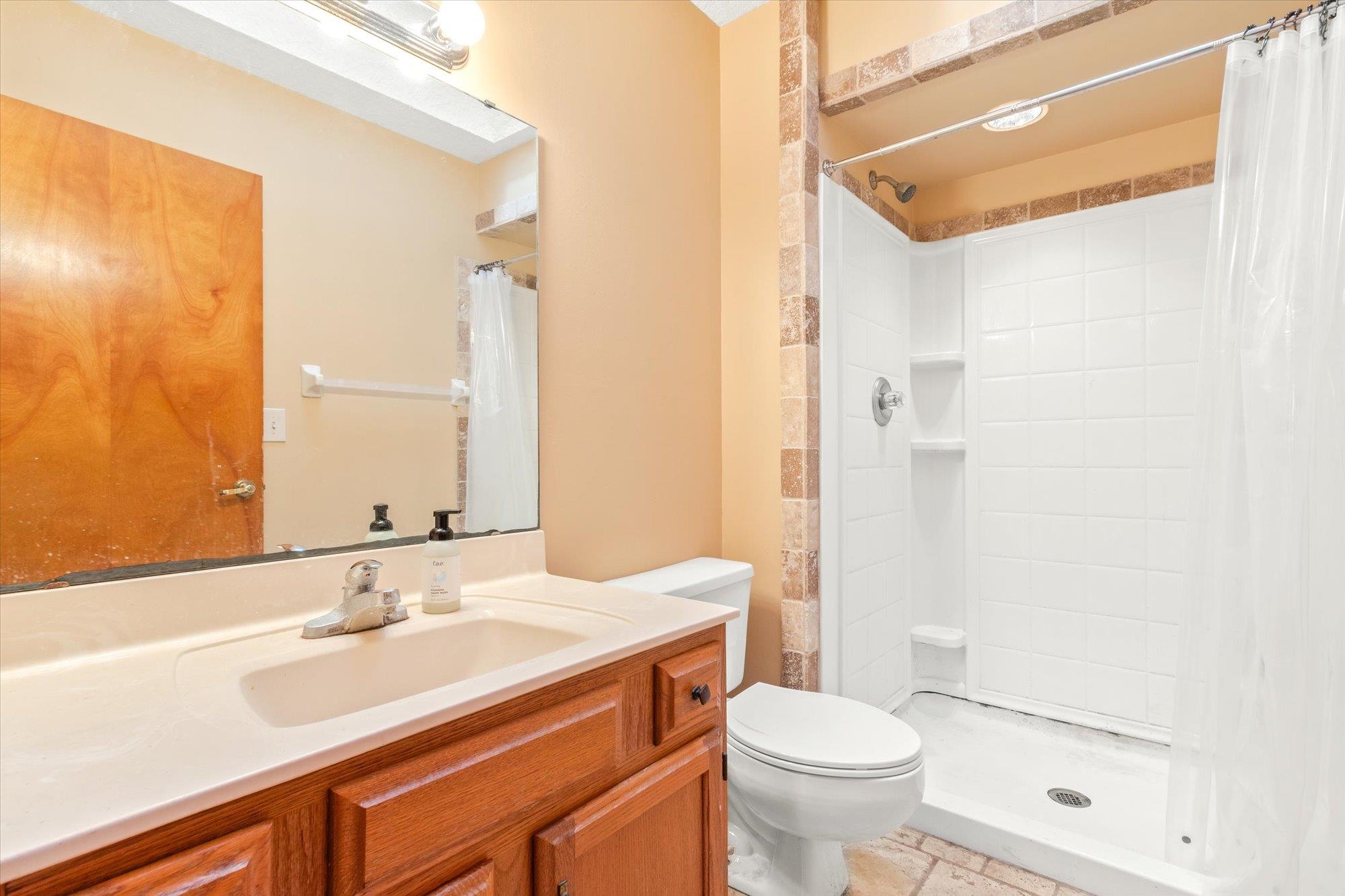 913 Chippewa Street St. Augustine, FL 32086 - Photo 32 of 56 a bathroom with a sink a toilet and shower