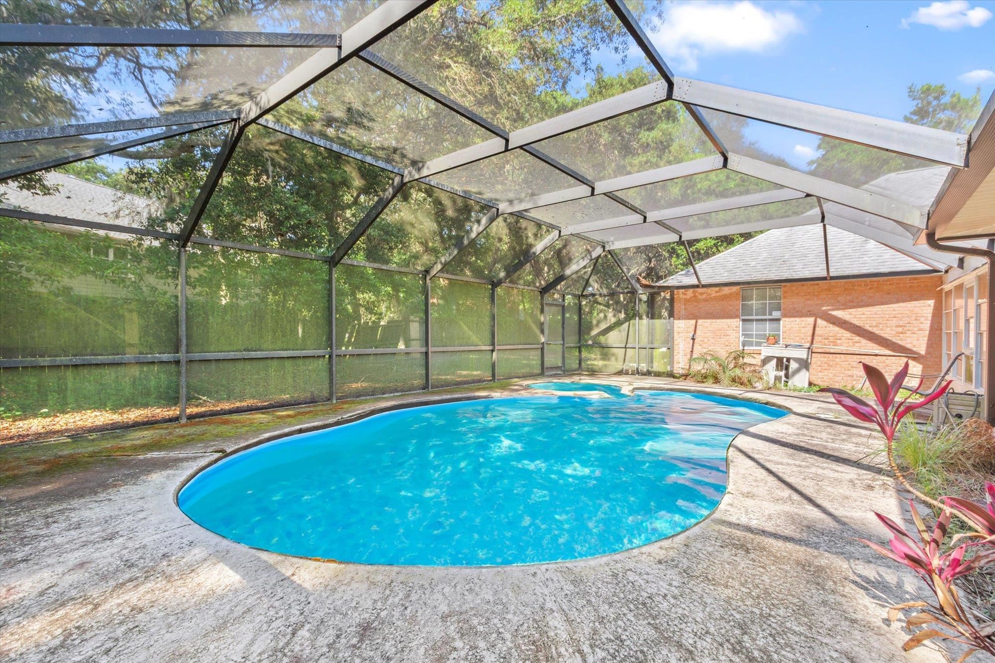 913 Chippewa Street St. Augustine, FL 32086 - Photo 42 of 56 a view of a swimming pool with a patio and a yard