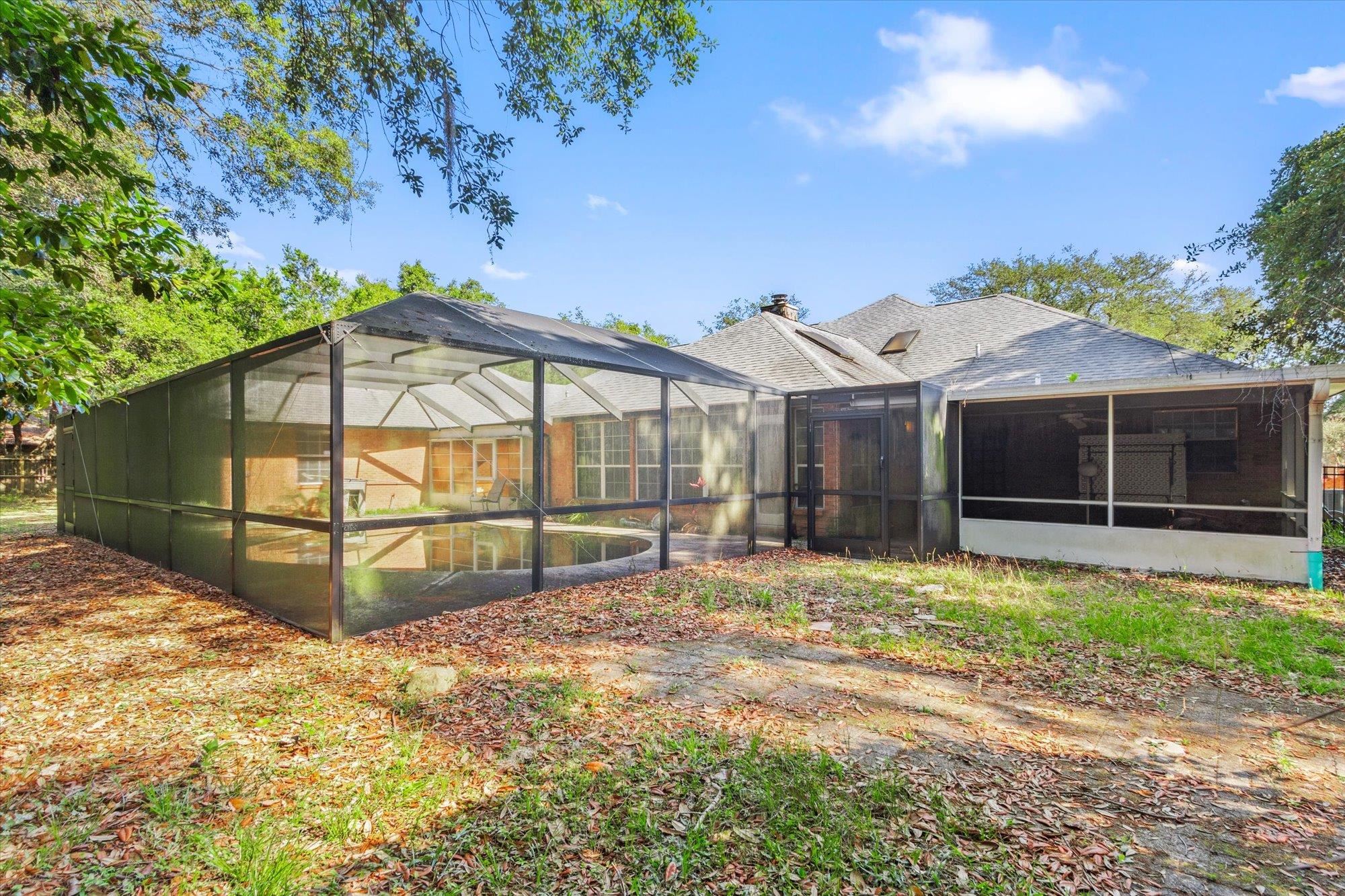 913 Chippewa Street St. Augustine, FL 32086 - Photo 50 of 56 a view of a house with a yard and wooden fence